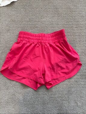 Women’s bright pink lululemon track that shorts